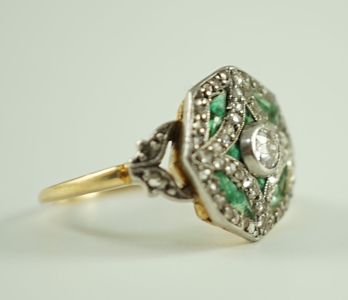 A Belle Epoque gold, emerald and diamond cluster set octagonal dress ring